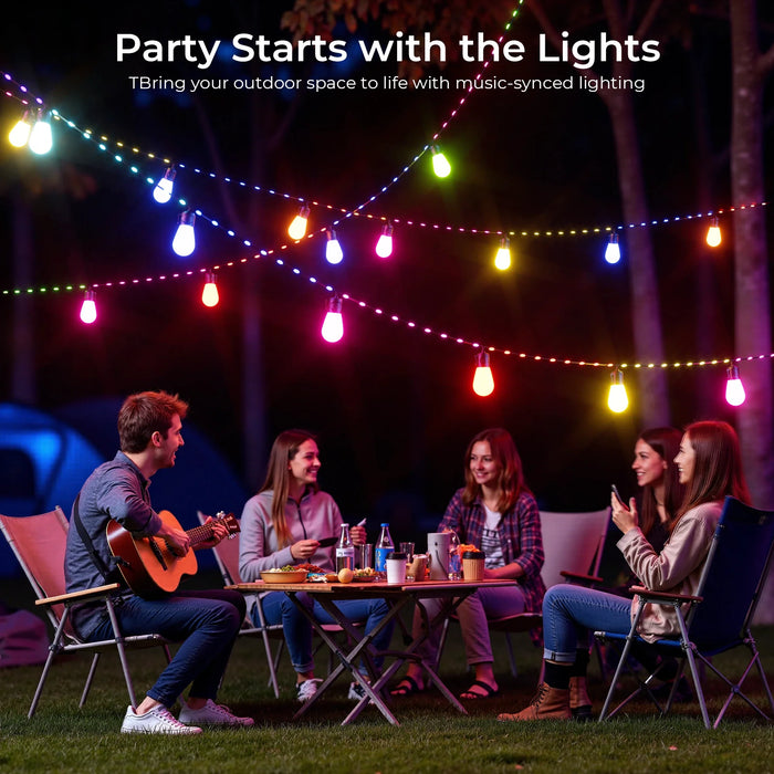 People sitting around a table under colorful string lights in an outdoor setting.