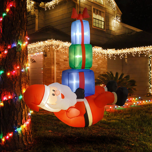 5FT Prelit Inflatable Santa Claus Hanging Under 3 Gift Boxes with LED Lights - Outdoor Christmas Decoration - Monsta Online