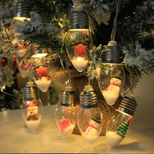 Decorative Christmas lights shaped like light bulbs with small figures inside, hanging on a tree.