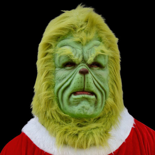 Green mask with Santa Claus outfit on a black background