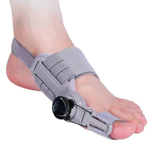 Gray foot orthosis being worn on a foot against a white background
